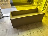 a bench that is in front of a glass door