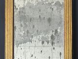 an old picture frame hanging on the wall of a room