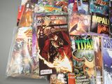 a lot of comic books that are on the table