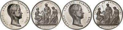 a close up of four different types of silver coins on a white background