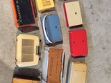 a lot of old radio ' s that are on the floor