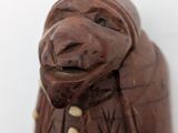 a small statue of a bear that is on a table