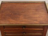 an old wooden table with a drawer on top of it