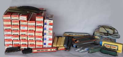 a lot of toy trains that are sitting on a table