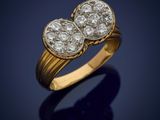 a gold and diamond ring, by business