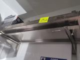 a stainless steel oven with a yellow sticker on it