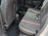 two seats in the back of a car with pink trims