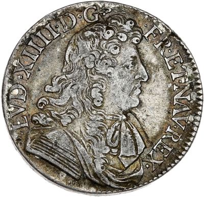 Pièce d'argent portant l'image d'un homme portant une couronne.