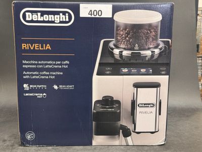 packaging of a black and white blender sitting on top of a counter