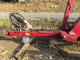 an image of a tractor that has fallen over on the side of the road