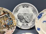 three plates with different designs on them on a table