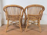 pair of vintage rattan chairs in the style of the early 20th century