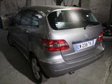 a silver car that is parked in a garage