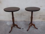 two tables that are sitting on the concrete floor