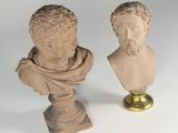 pair of marble busts of a man and a woman