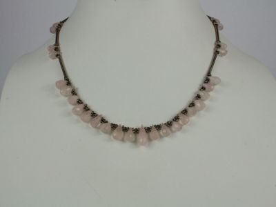 a close up of a necklace on a mannequin mannequin