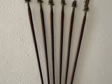 a wall with a bunch of old weapons hanging on it