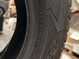 a close up of a tire on display in a store