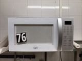 a microwave that has a number on the front of it