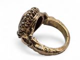 an image of a gold ring with a stone in the middle