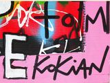 a painting on the wall of a building that has graffiti written on it
