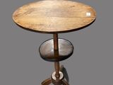 an image of a small table with a wooden top on a gray background