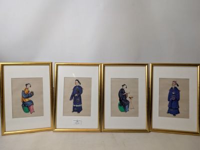 three framed pictures of asian women sitting on a table