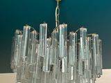 a chandelier hanging from the ceiling in a room