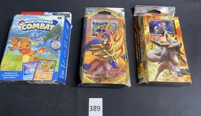 three pokemon trading cards are on a table with a price tag