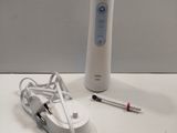 a remote control and a charger on a table