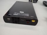 an image of a small portable projector on a table