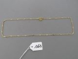 a gold chain with a price tag attached to it