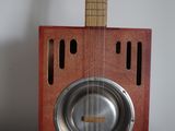 a guitar that is sitting on top of a table