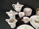many plates, cups, and saucers that are on the table