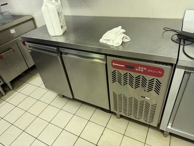 stainless steel counter top in a commercial kitchen with a lot of counter space