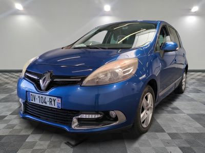 a picture of a blue car parked in a garage
