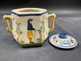 a picture of a ceramic cup and saucer with a lid