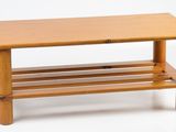 a small wooden table with a shelf underneath it