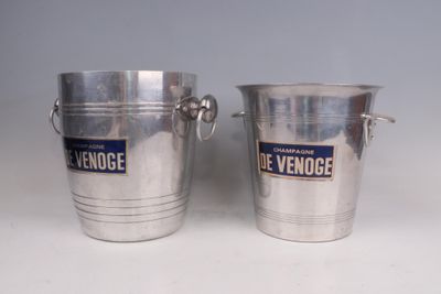two silver metal buckets with handles and handles on a white surface