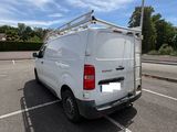 a white van that is parked in a parking lot