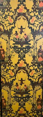 a yellow and black cabinet with a pattern on it