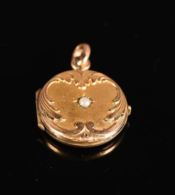 an image of a gold locke with a diamond in the center