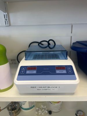 a blender that is sitting on a shelf in a kitchen