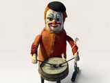 a toy figure of a clown with a drum