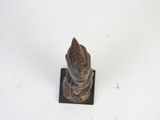 a statue of a bird that is sitting on top of a square