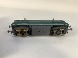an image of a green train car sitting on top of a white surface
