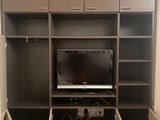 a picture of a living room with a flat screen tv