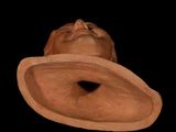 a clay sculpture of a man with a hat on his head