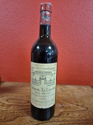 a bottle of wine that is sitting on a table