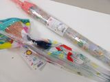 two pens that are wrapped in plastic bags on a table